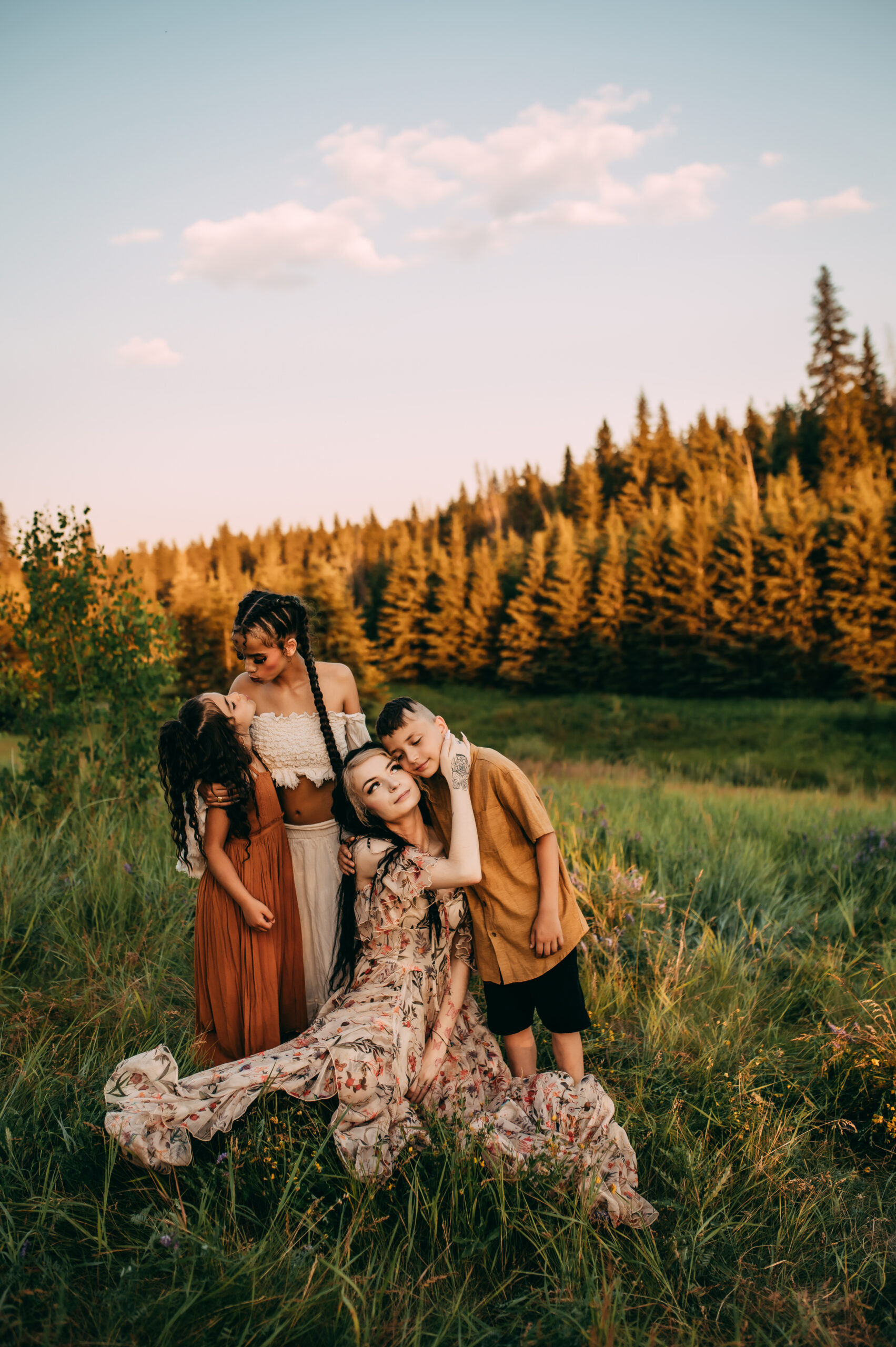 Motherhood and family photoshoot in south edmonton grassy field at sunset